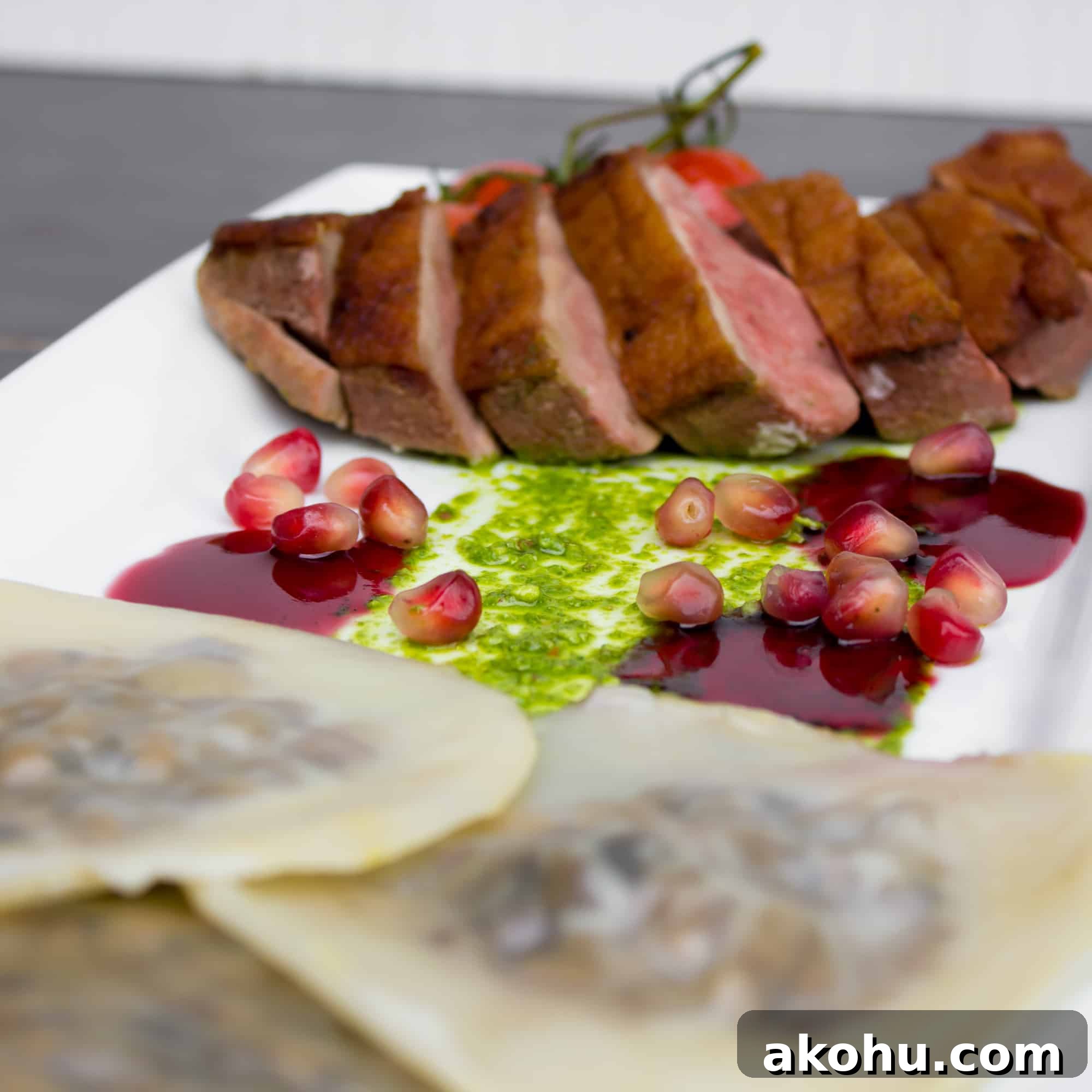 Duck Breast & Cognac Duxelle Wonton Ravioli with Pomegranate Sauce 2 Duck Breast and Cognac Duxelle Wonton Ravioli Recipe with Pomegranate Cognac Sauce and Basil Pesto.