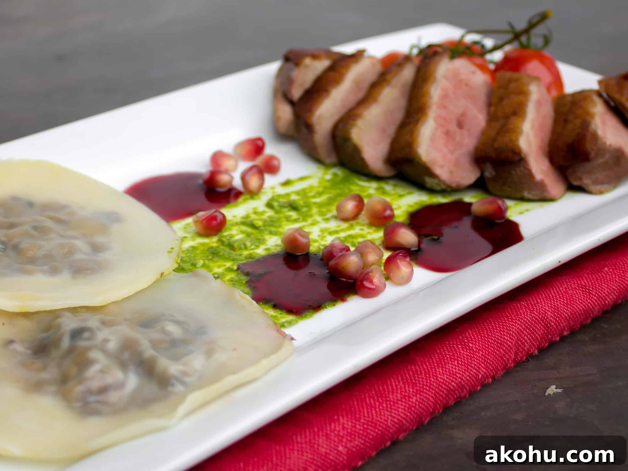 Duck Breast & Cognac Duxelle Wonton Ravioli with Pomegranate Sauce 4 Duck Breast and Cognac Duxelle Wonton Ravioli Recipe with Pomegranate Cognac Sauce and Basil Pesto.