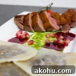 Duck Breast & Cognac Duxelle Wonton Ravioli with Pomegranate Sauce 5 Duck Breast and Cognac Duxelle Wonton Ravioli Recipe with Pomegranate Cognac Sauce and Basil Pesto.