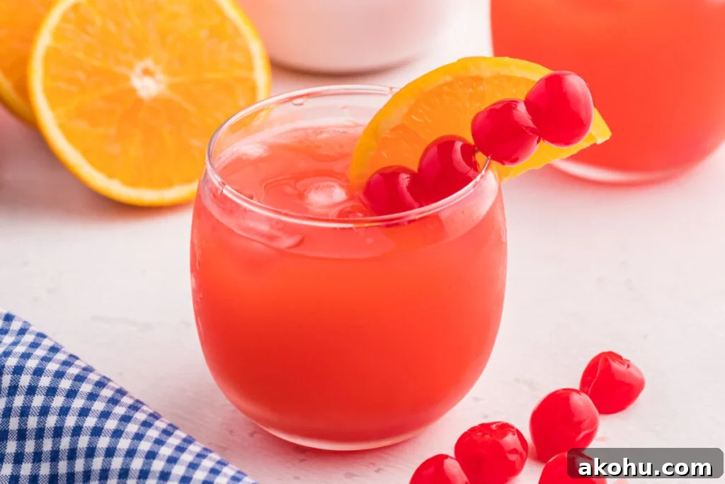 Shirley Temple Punch Recipe: Classic Fizzy Mocktail Guide 5 shirley temple punch mocktail garnished with cherries and orange slice