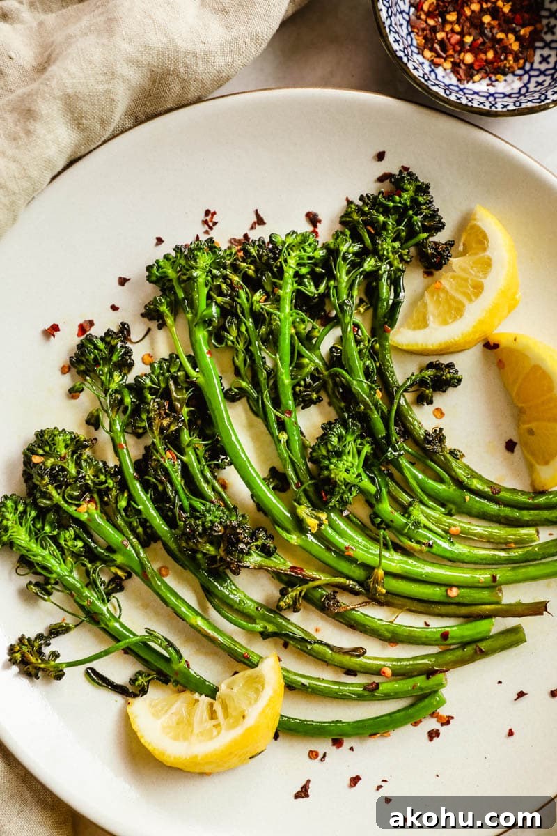 20 Delicious Side Dishes to Serve with Roasted Chicken 13 Easy delicious charred broccolini/broccoletti on a plate with seasoning, lemon wedges, and chili flakes.