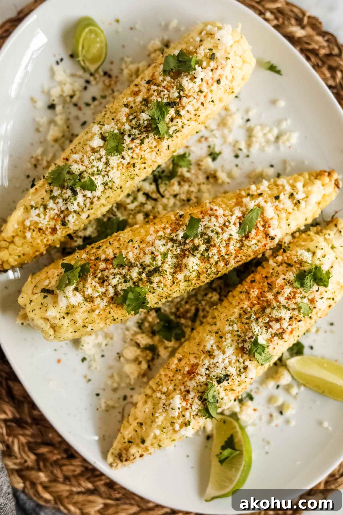 20 Delicious Side Dishes to Serve with Roasted Chicken 4 Elote-style corn with furikake and kewpie mayo on a plate flatlay.