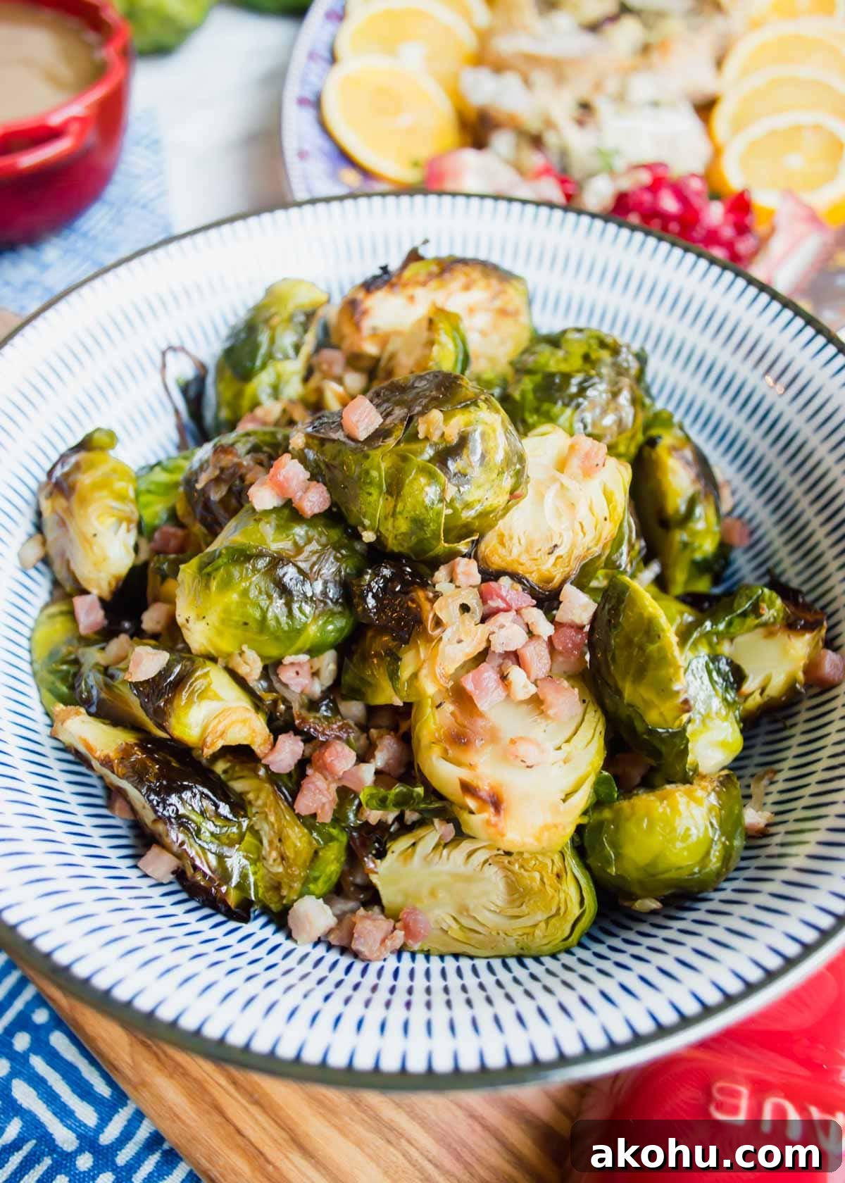 20 Delicious Side Dishes to Serve with Roasted Chicken 7 Maple Brussel Sprouts with Pancetta in bowl flatlay.