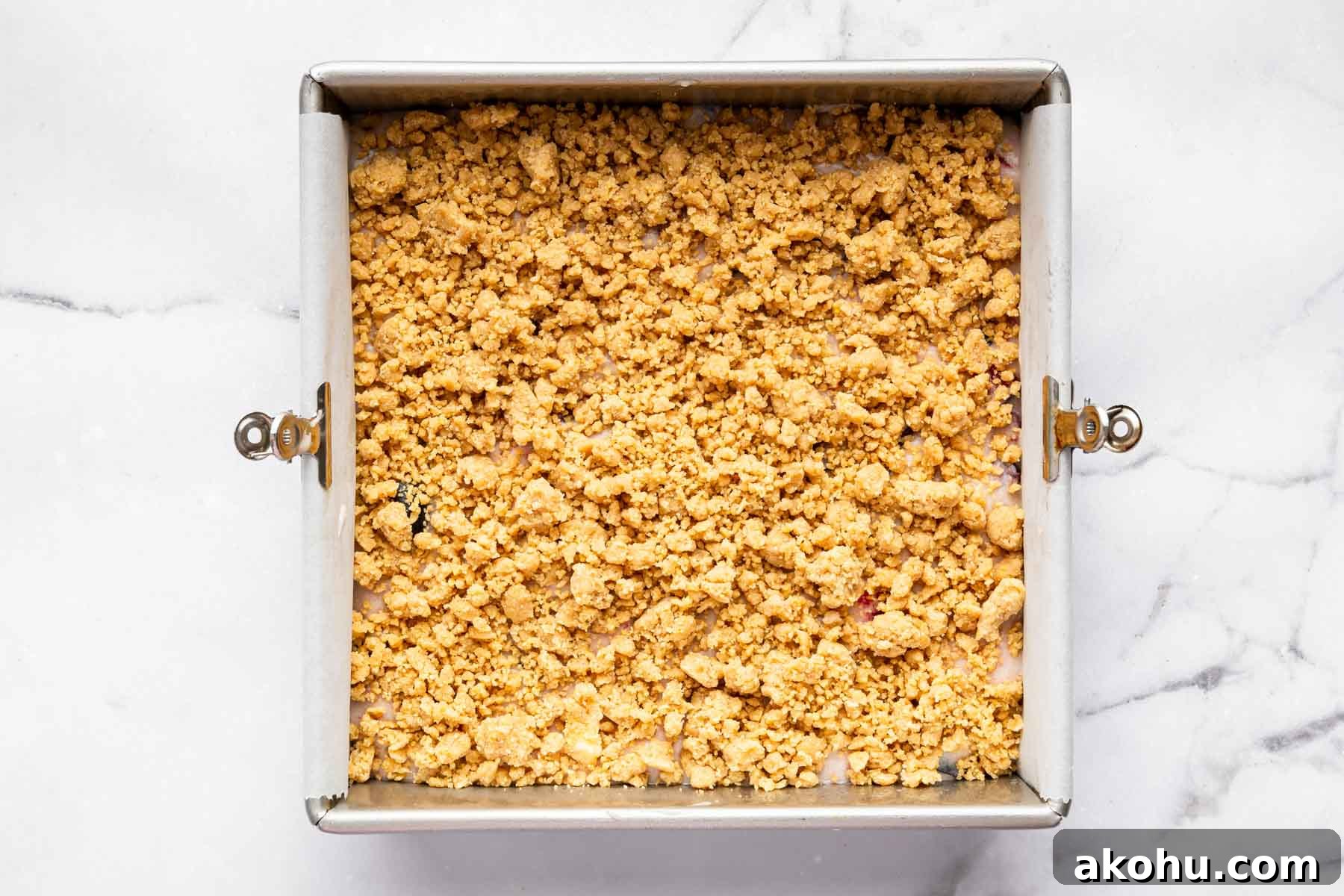 Classic Plum Cake Recipe: Moist, Fragrant Holiday Dessert 12 Square dessert with big streusel chunks on top before baking.