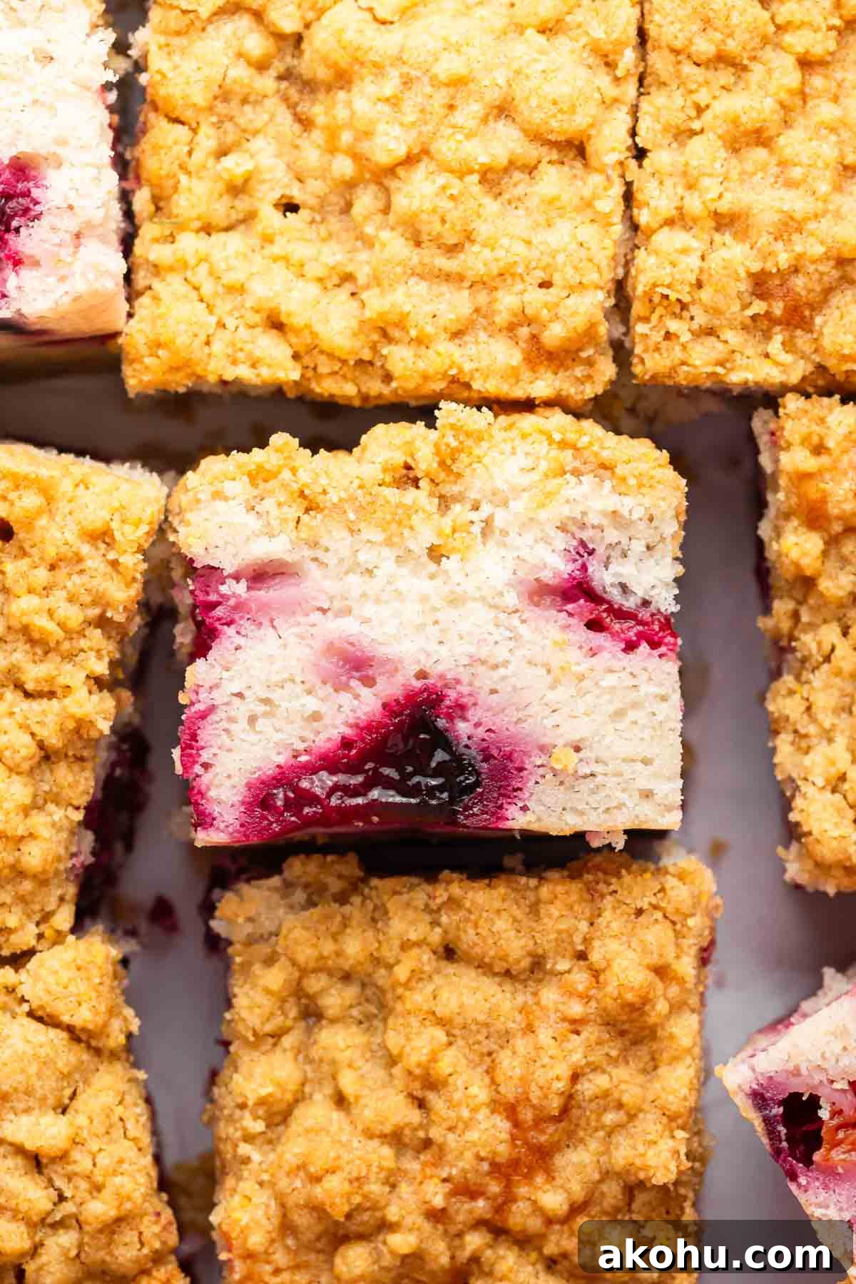 Classic Plum Cake Recipe: Moist, Fragrant Holiday Dessert 14 Slice of plum cake with streusel turned on its side to show interior.
