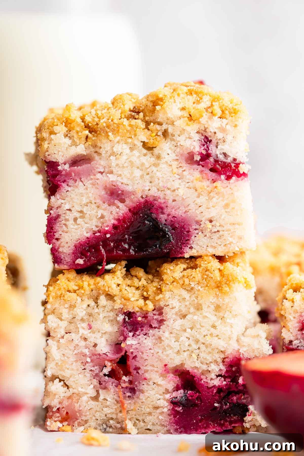 Classic Plum Cake Recipe: Moist, Fragrant Holiday Dessert 3 Two slices of plum cake stacked on top of each other.