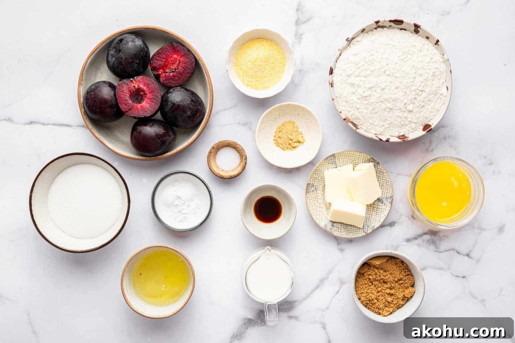 Classic Plum Cake Recipe: Moist, Fragrant Holiday Dessert 4 Bowl of fresh fruit, cornmeal, flour, melted butter, and brown sugar on kitchen counter.