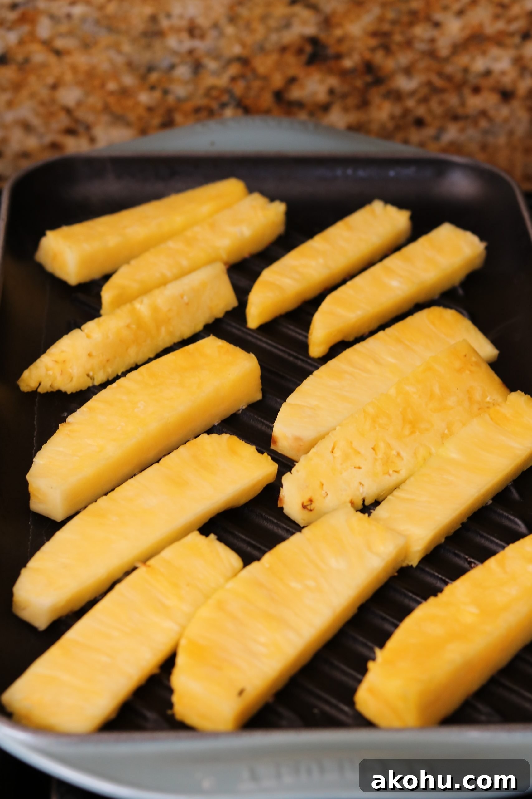 Grilled Steak with Pineapple Jalapeño Salsa Recipe 11 raw pineapple spears being grilled