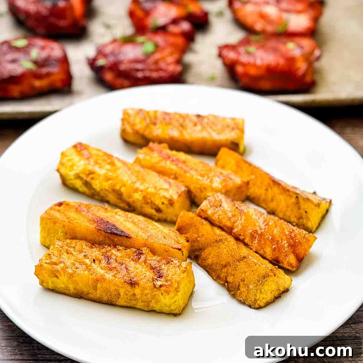 A platter of smoked pineapple spears, beautifully caramelized.