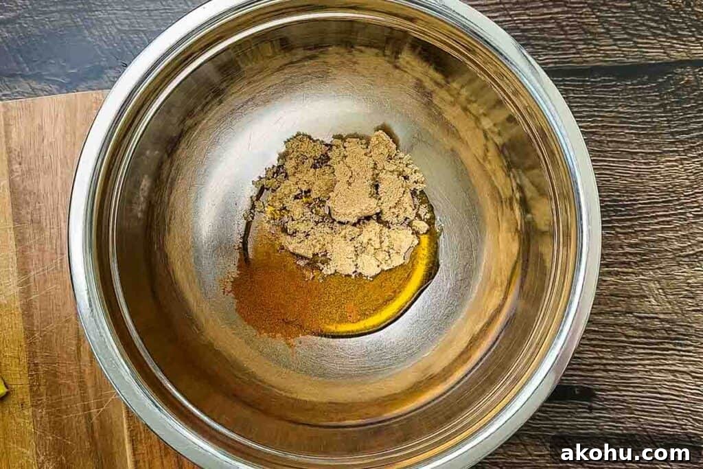 A bowl with brown sugar, maple syrup, and ground cinnamon.