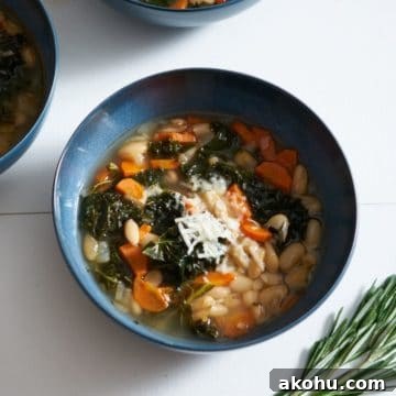 Tuscan white bean soup in a blue bowl.