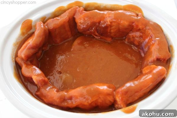 Apple BBQ Slow Cooker Ribs — Tender Fall-Off-The-Bone Recipe 11 Slow Cooker Apple BBQ Ribs - apple flavors to our ribs along with some sweet brown sugar flavors to give these ribs a yummy kick. Great Crock-Pot meal idea.