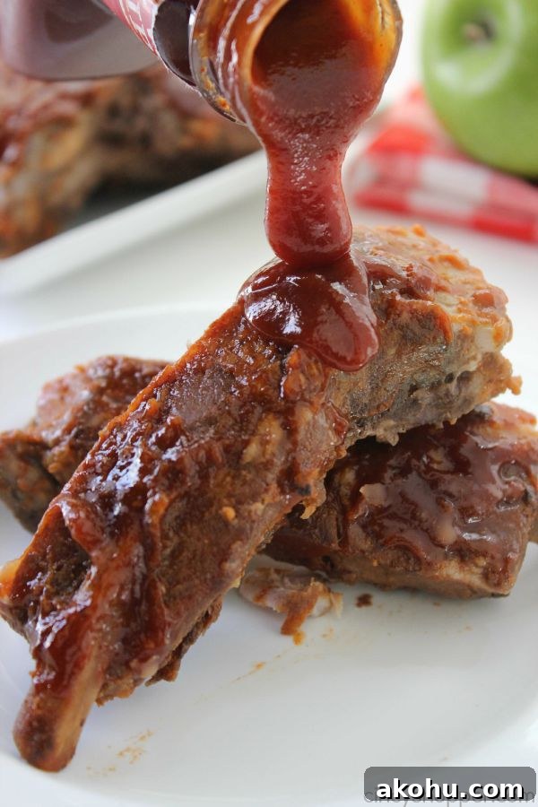 Apple BBQ Slow Cooker Ribs — Tender Fall-Off-The-Bone Recipe 4 Slow Cooker Apple BBQ Ribs - apple flavors to our ribs along with some sweet brown sugar flavors to give these ribs a yummy kick. Great Crock-Pot meal idea.