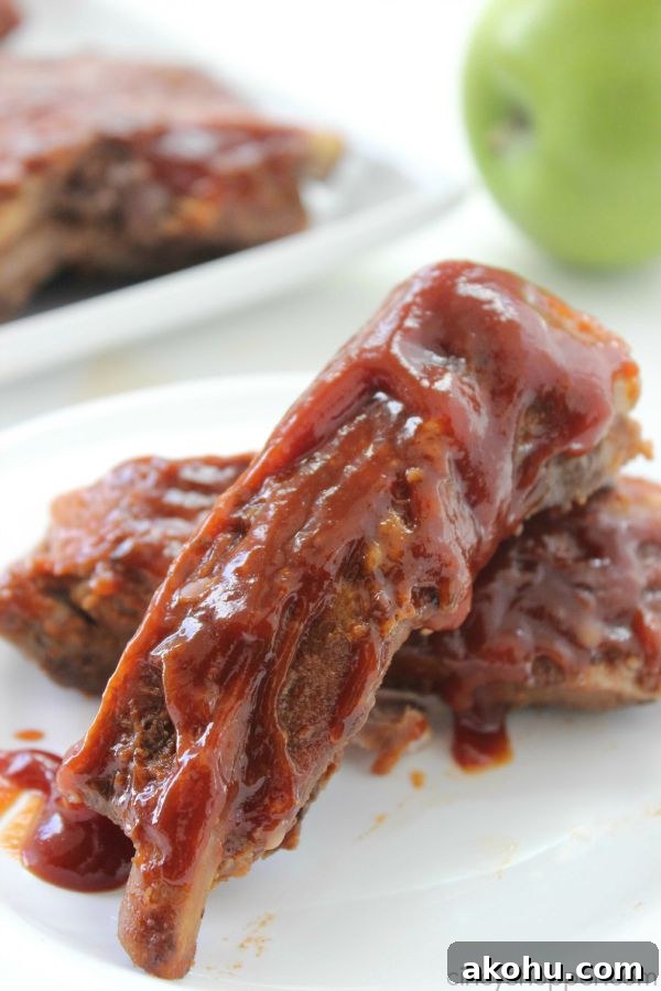 Apple BBQ Slow Cooker Ribs — Tender Fall-Off-The-Bone Recipe 5 Slow Cooker Apple BBQ Ribs - apple flavors to our ribs along with some sweet brown sugar flavors to give these ribs a yummy kick. Great Crock-Pot meal idea.