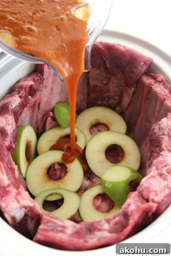 Apple BBQ Slow Cooker Ribs — Tender Fall-Off-The-Bone Recipe 10 Slow Cooker Apple BBQ Ribs - apple flavors to our ribs along with some sweet brown sugar flavors to give these ribs a yummy kick. Great Crock-Pot meal idea.