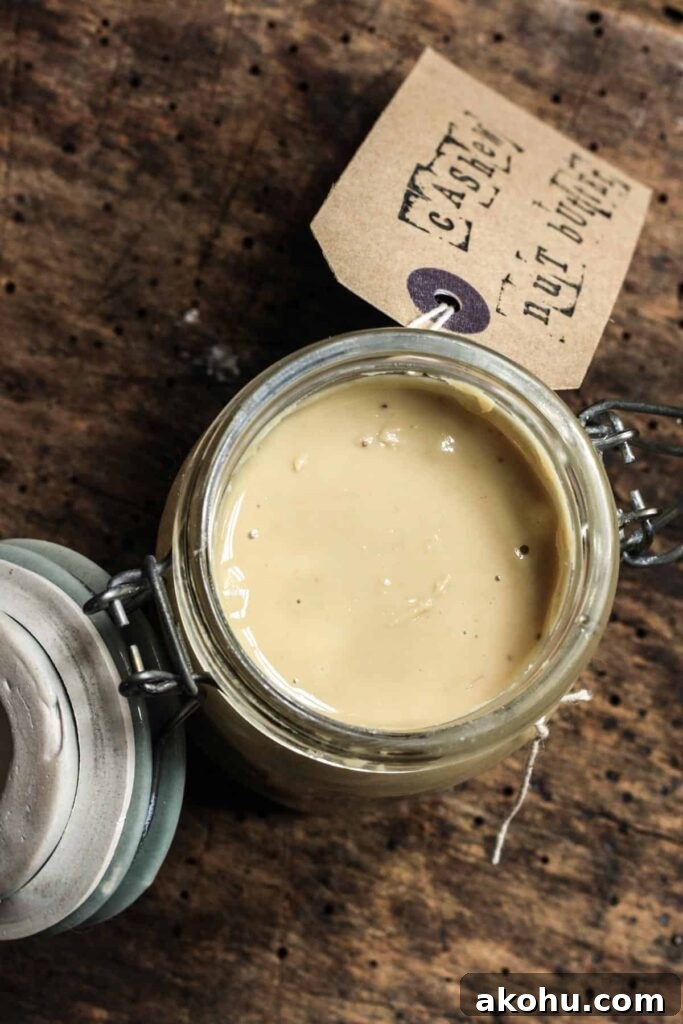 Oil-Free Homemade Cashew Butter Recipe — Smooth & Creamy 3 overhead of jar of cashew butter