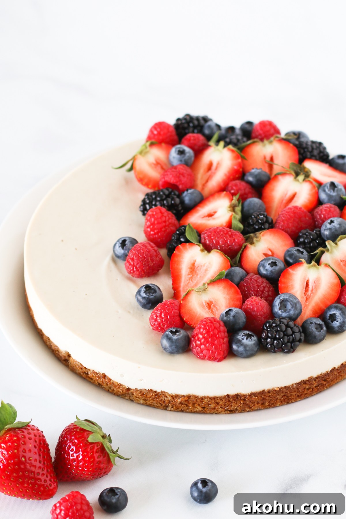 Gluten Free Vegan Berry Cheesecake. You will go head over heals for this dairy free cheesecake! Made with cashews, the creamy texture is perfectly paired with the fresh berries.