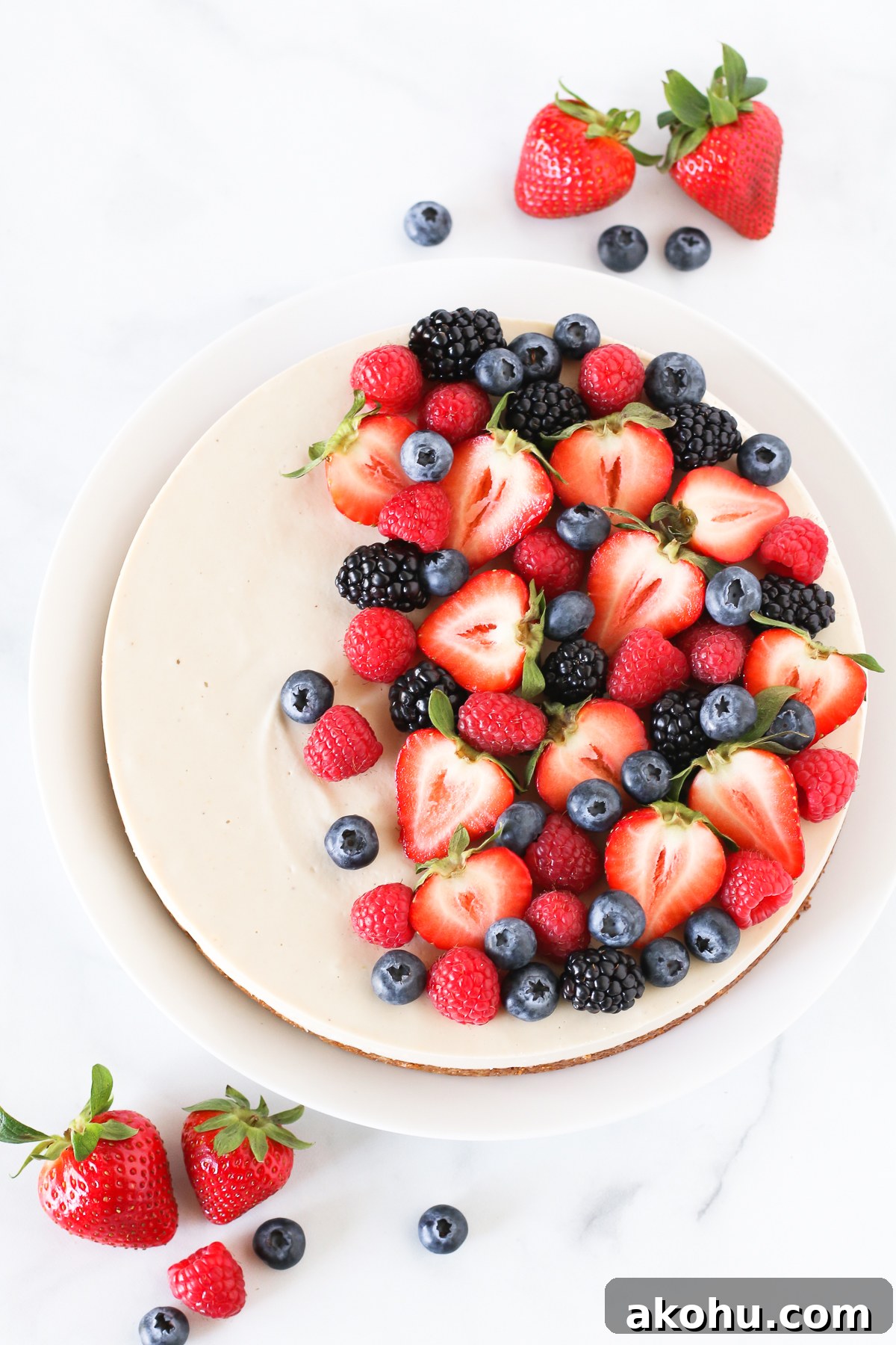 Gluten Free Vegan Berry Cheesecake. You will go head over heals for this dairy free cheesecake! Made with cashews, the creamy texture is perfectly paired with the fresh berries.