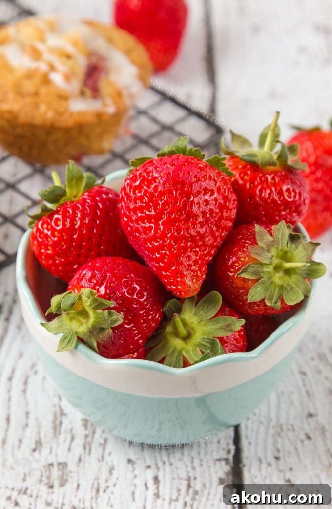 Fresh, juicy strawberries, chunks of white chocolate and oats make these Strawberry and White Chocolate Oatmeal Muffins hearty, full of flavour and just perfect for breakfast on the go!
