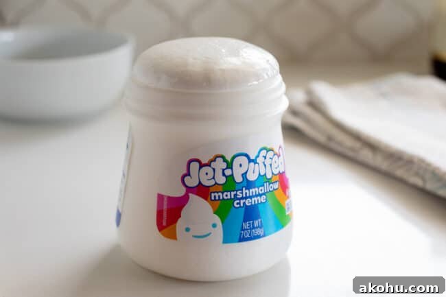 jet puffed marshmallow creme on a white counter with top puffed from microwave