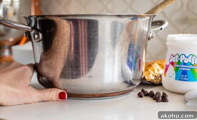 a heavy bottom pot with a thumb showing how thick the bottom is