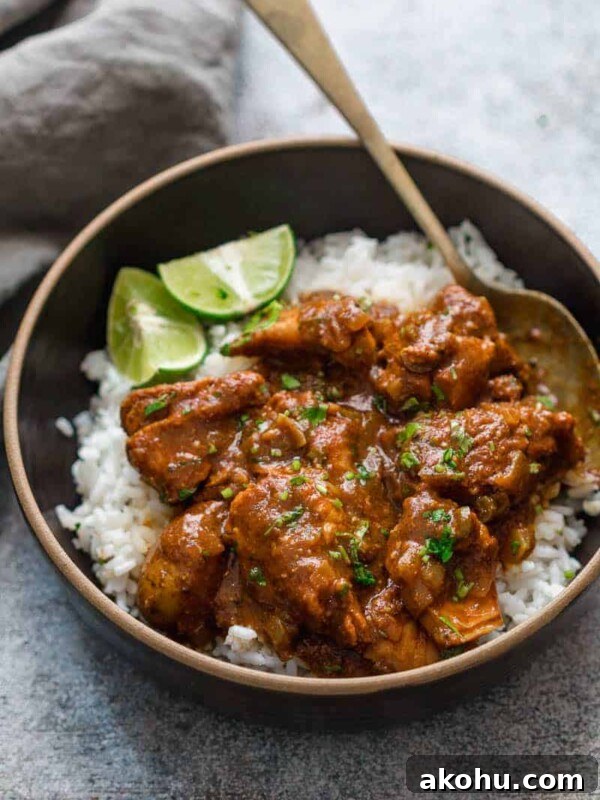 Slow cooker chicken curry served over rice.