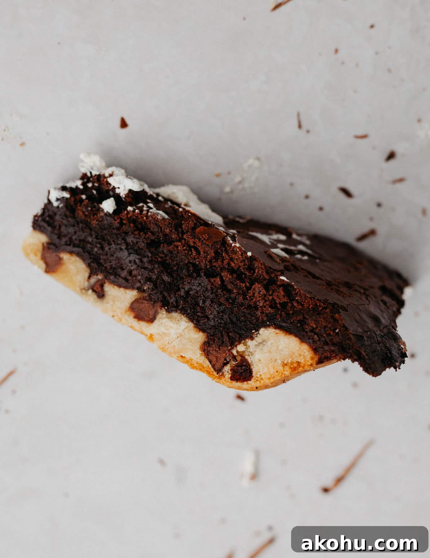A slice of brownie pie on it's side