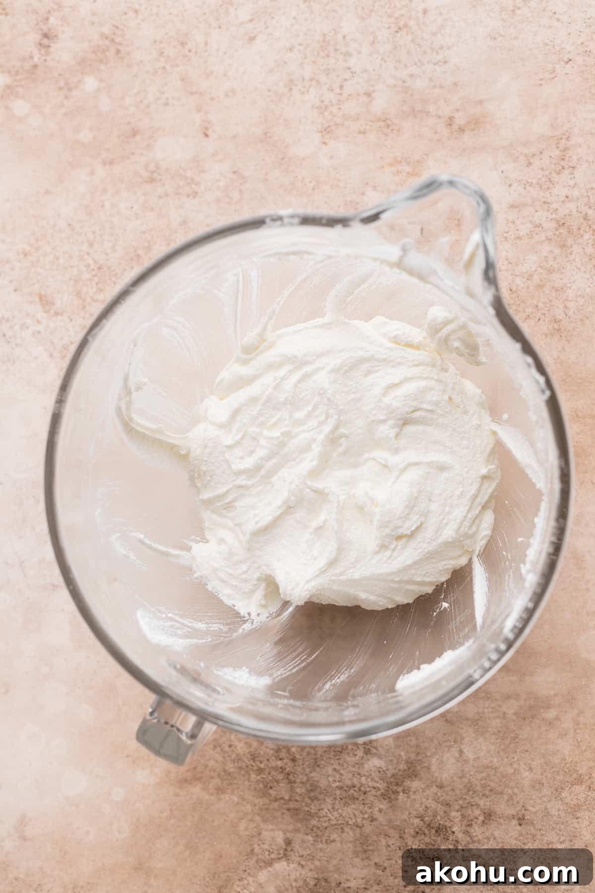 Whipped butter and sugar in a bowl.