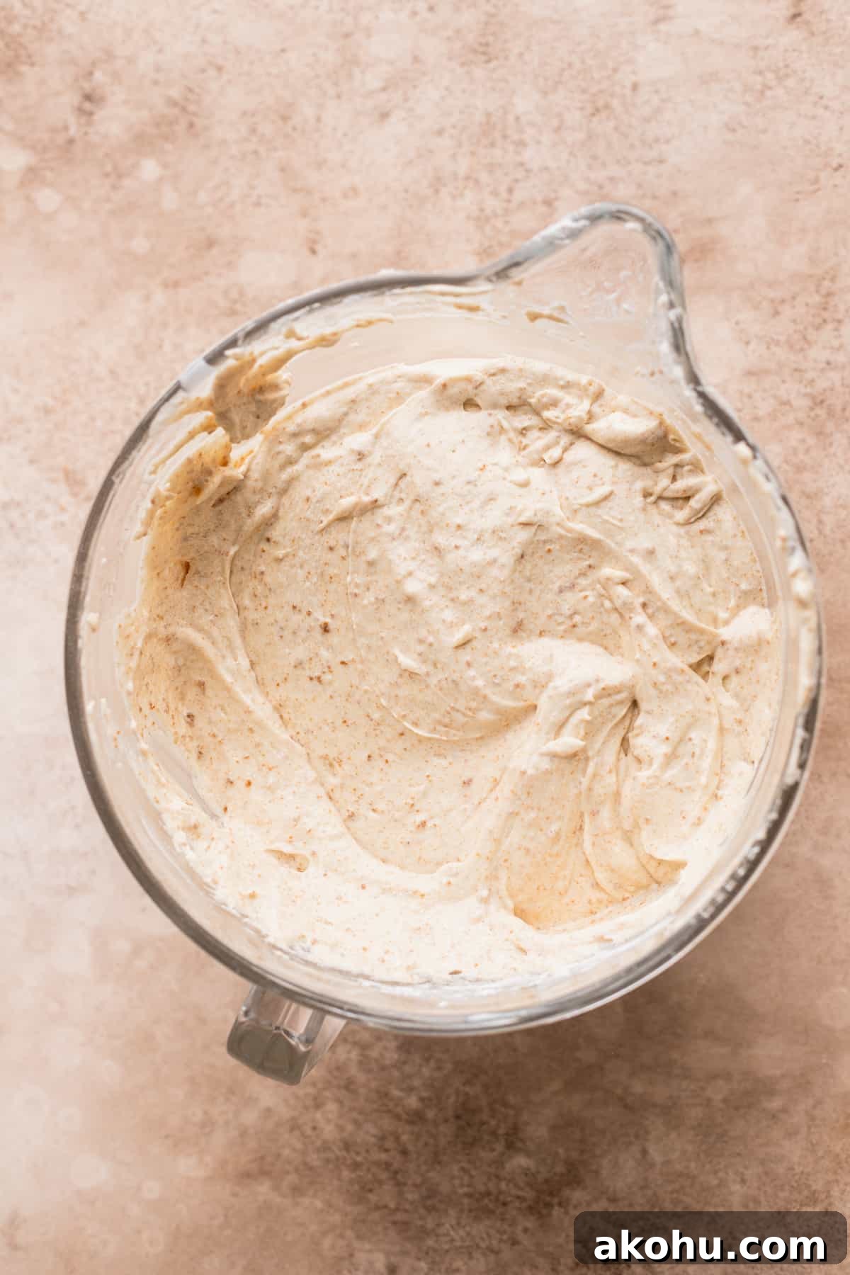 Cake batter in a glass bowl.