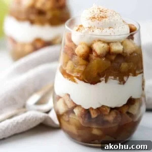 Close up of apple trifle topped with whipped cream.