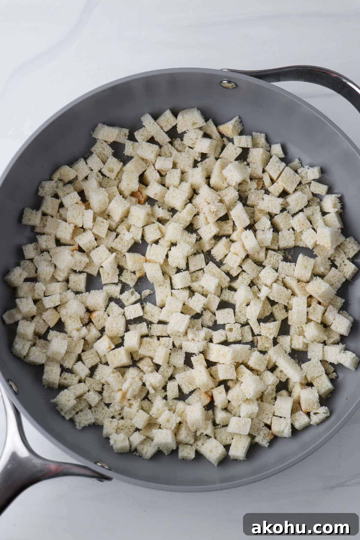 Bread cubes in a pan.