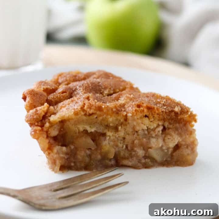 Swedish Apple Pie on a plate with a fork.