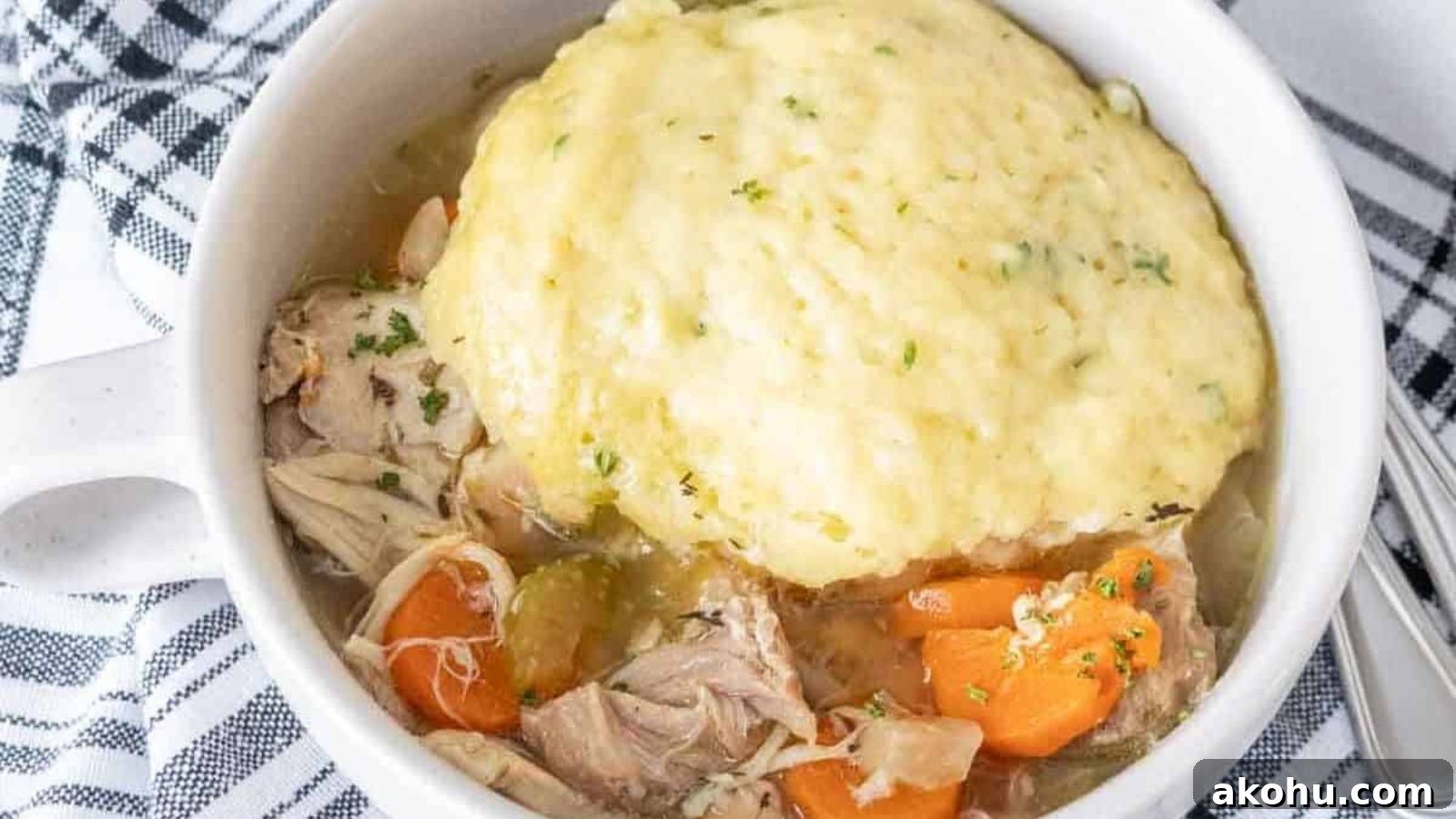 Chicken and dumplings slow cooked with soft dumplings on top.