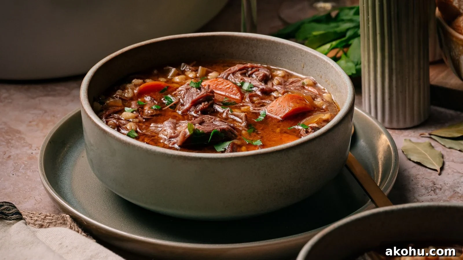 Beef and barley soup slow cooked with short ribs and vegetables.