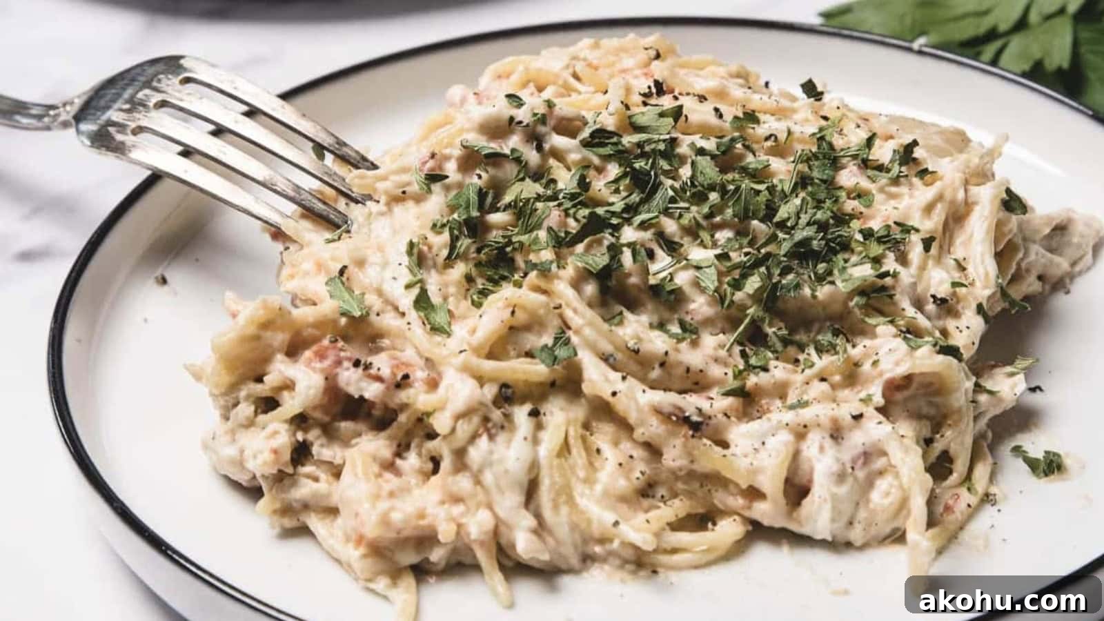 Chicken spaghetti slow cooked with pasta and creamy sauce.