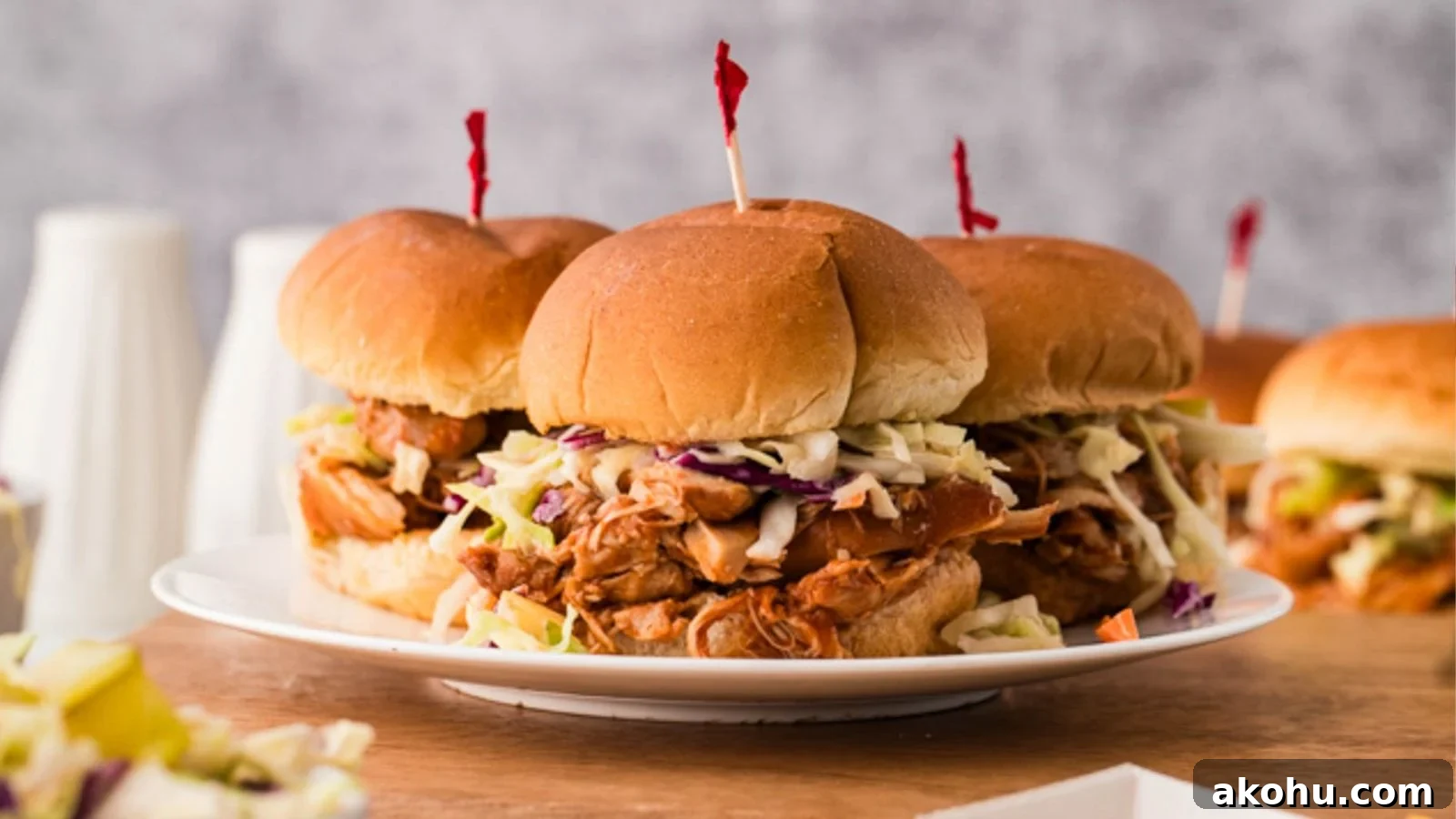 BBQ chicken cooked in a slow cooker until tender and piled onto soft rolls.