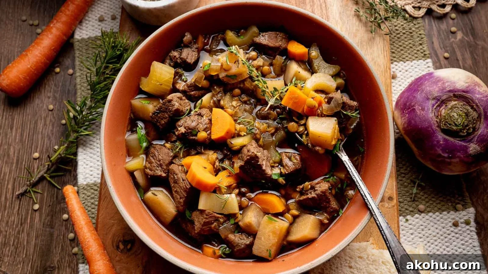 Beef stew with lentils slow cooked until thick, hearty, and aromatic.