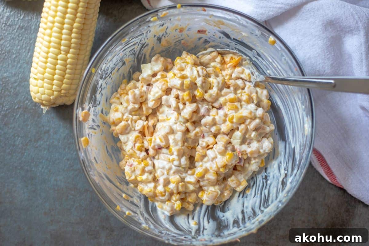Mixing bowl with corn dip mixed together.