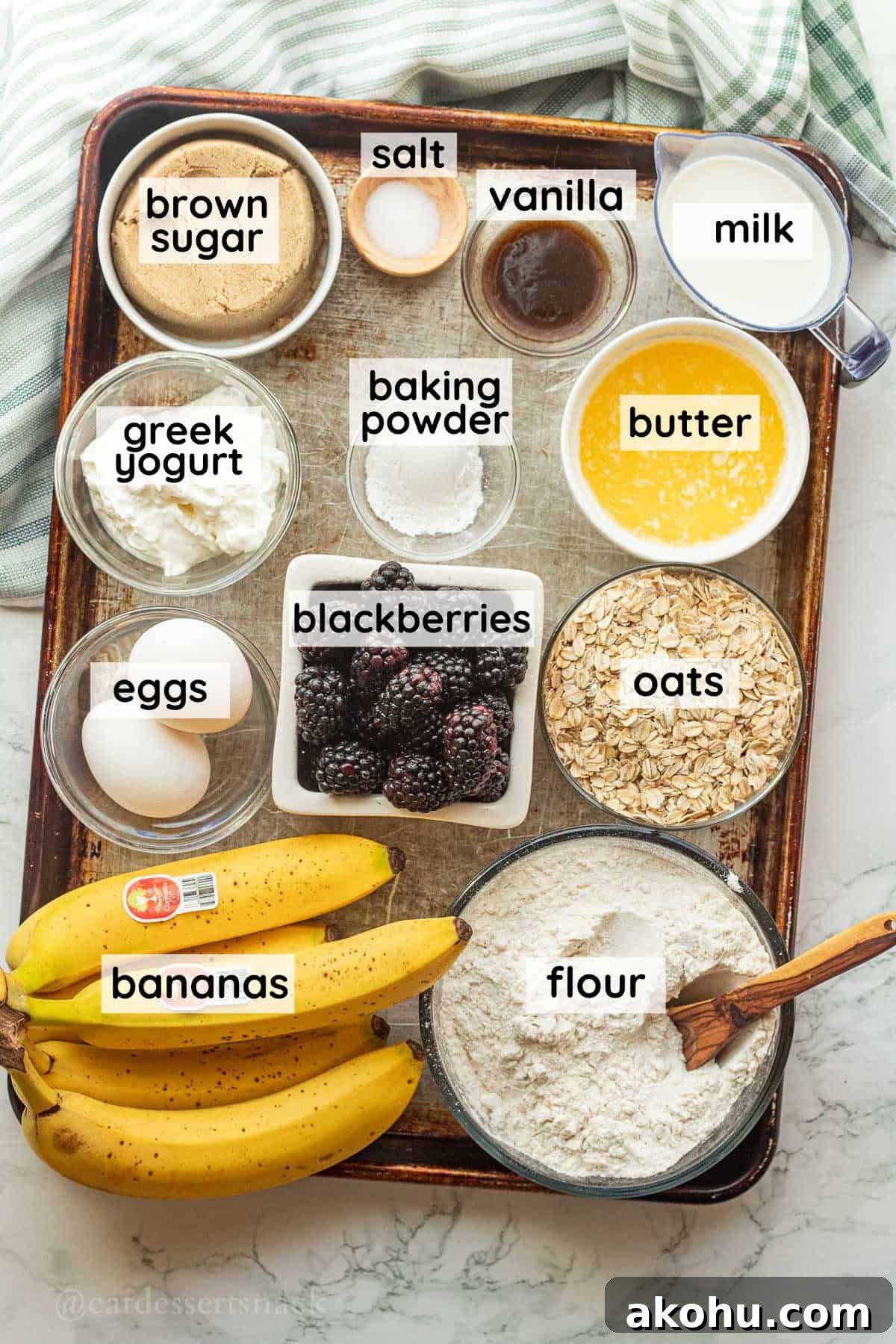 Banana Blackberry Oatmeal Muffins Recipe — Quick Baked Breakfast 3 Labeled ingredients for banana blackberry oat muffins on metal baking sheet.