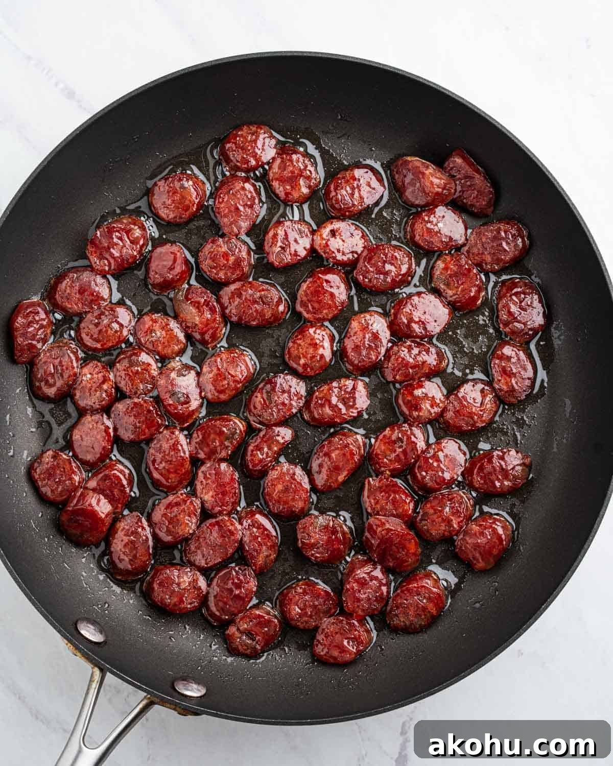 sliced chinese sausage in a pan.