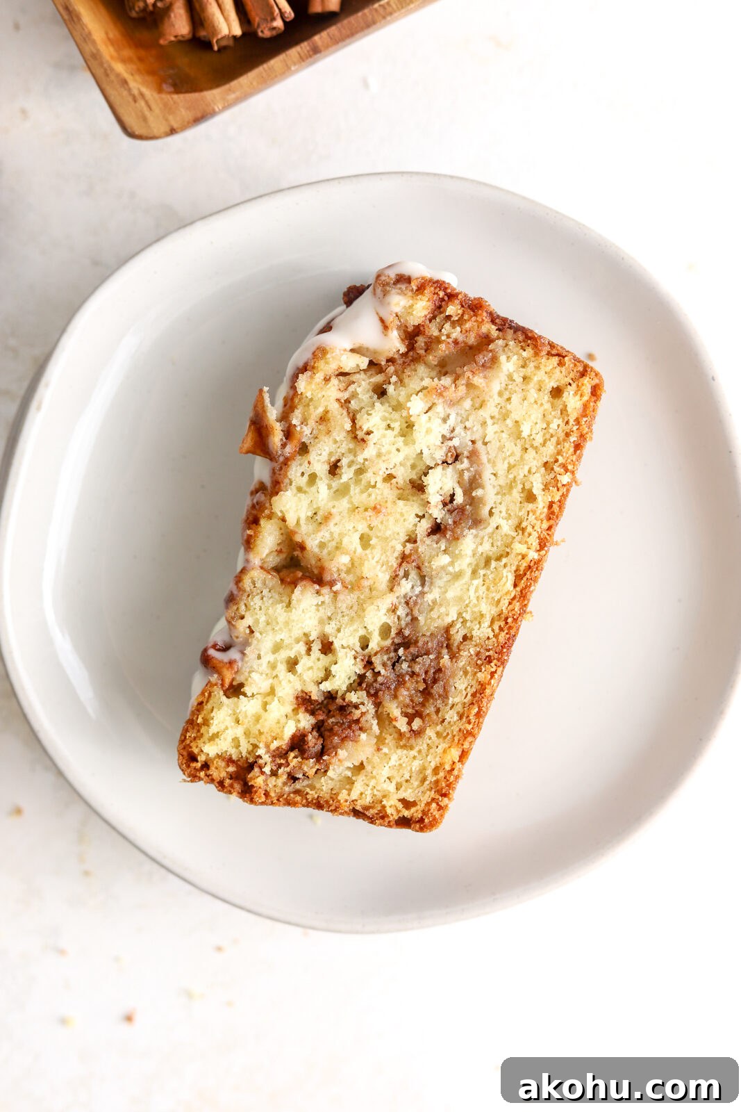 A slice of apple fritter bread with icing