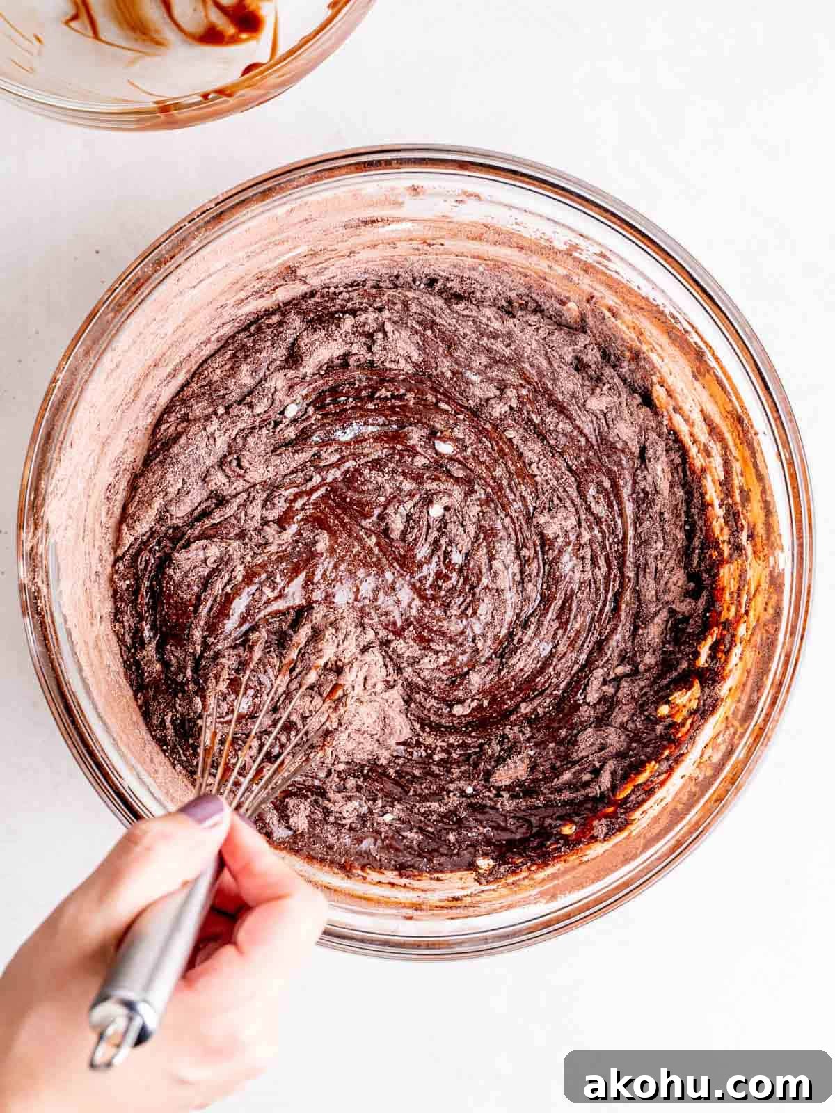 Decadent Andes Mint Brownies Recipe for Mint-Chocolate Lovers 6 Whisking flour, cocoa powder, baking powder, and salt into a chocolate mixture.