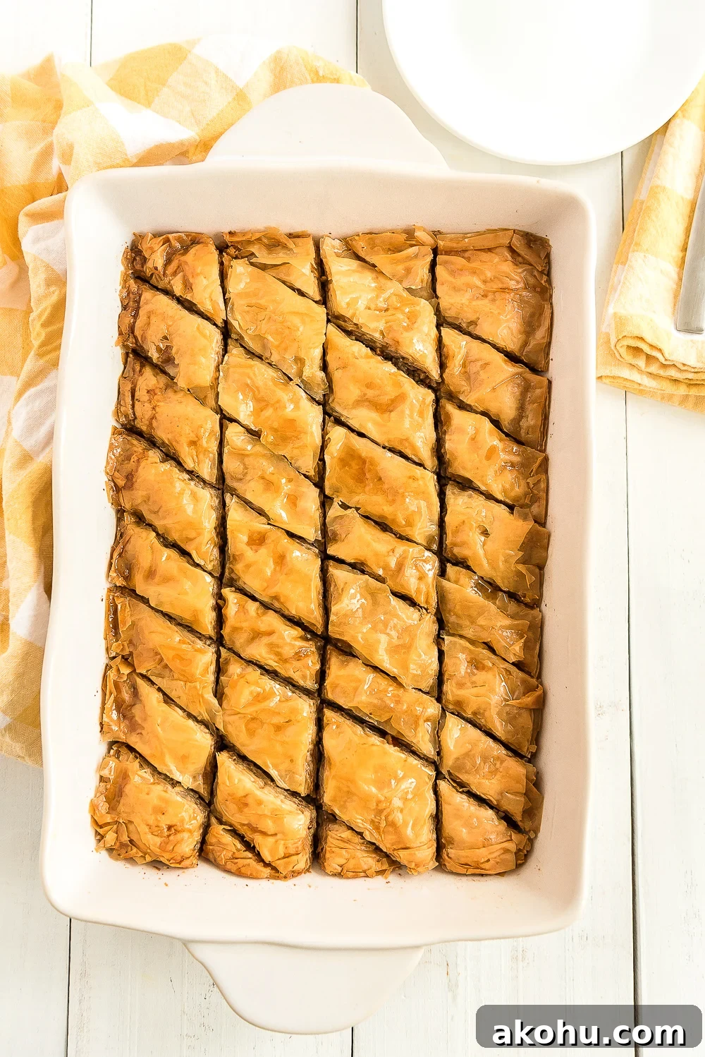 Authentic Homemade Baklava Recipe for Crispy Layers 7 Large baking dish filled with homemade baklava.
