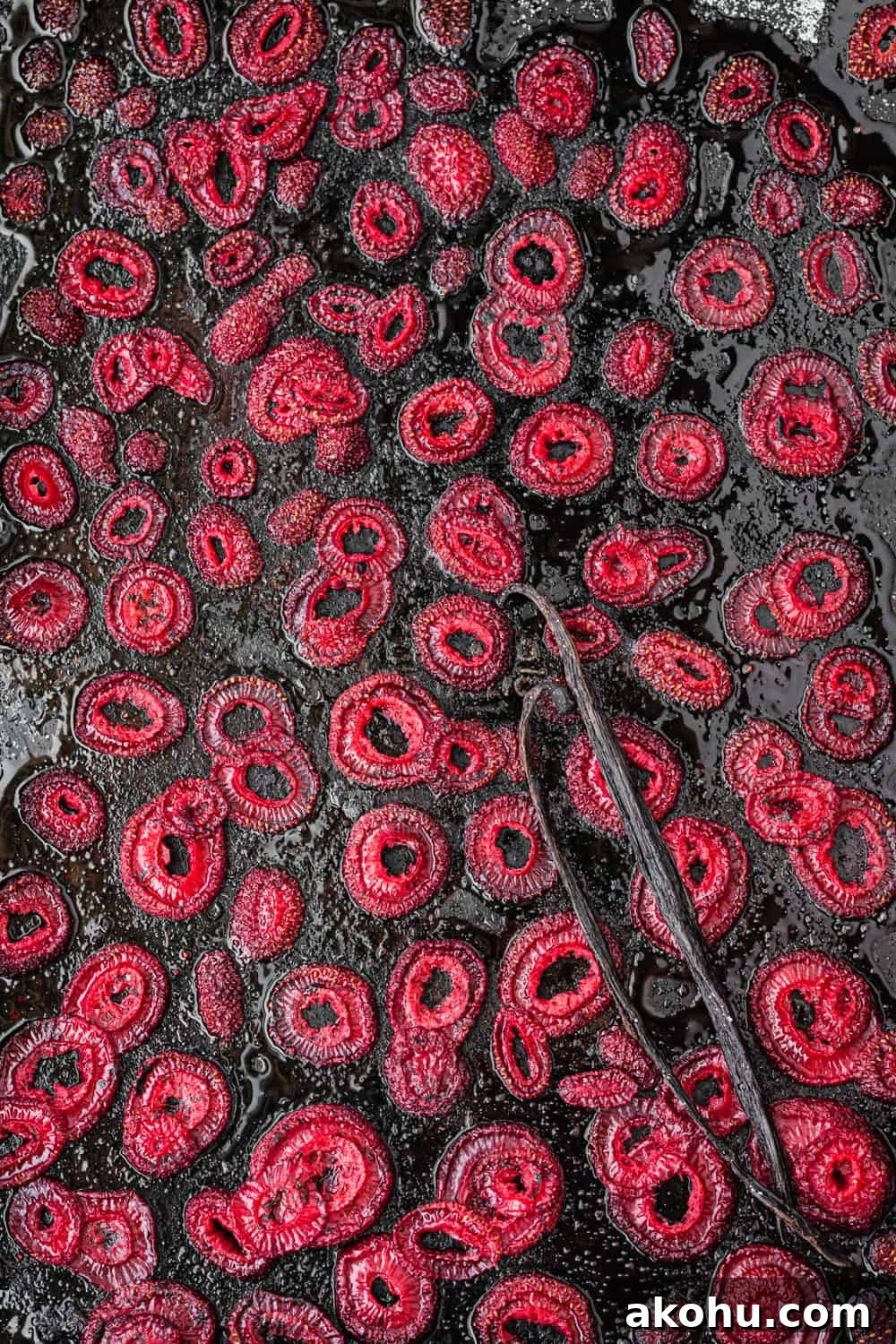Roasted Strawberries with vanilla beans on a baking sheet