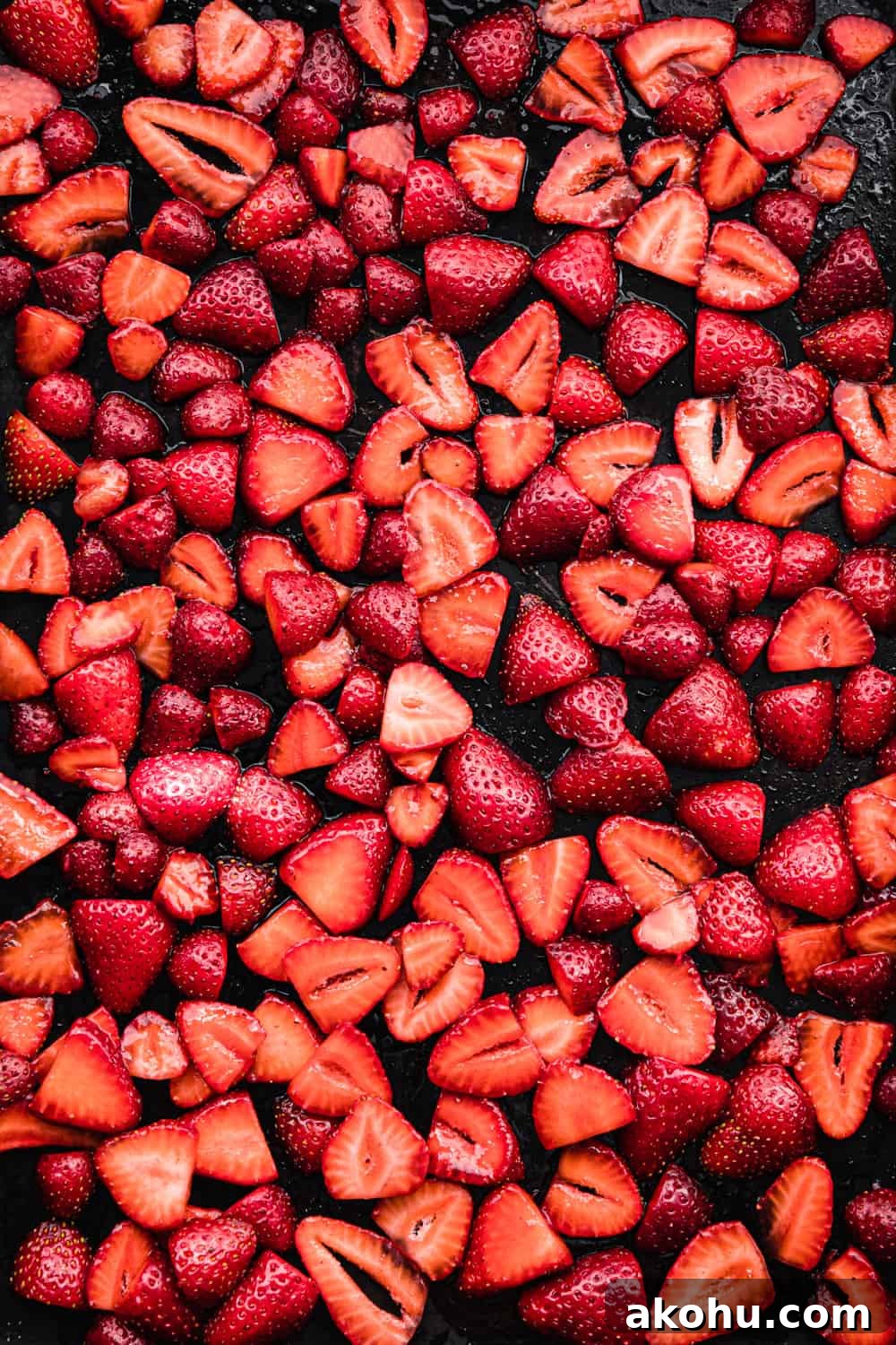 sliced strawberries on a baking sheet