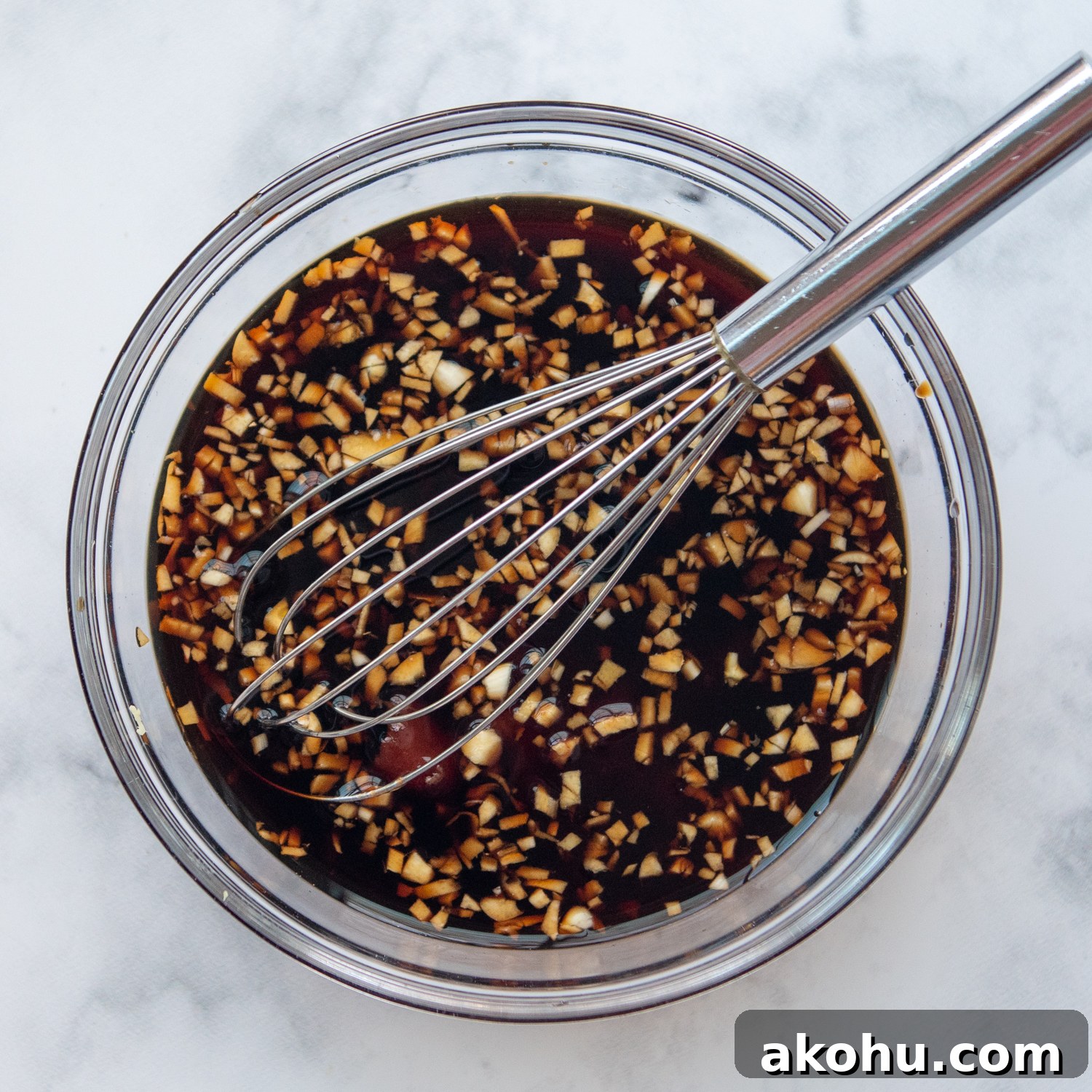 the ingredients for the honey soy sauce in a small bowl with a whisk.