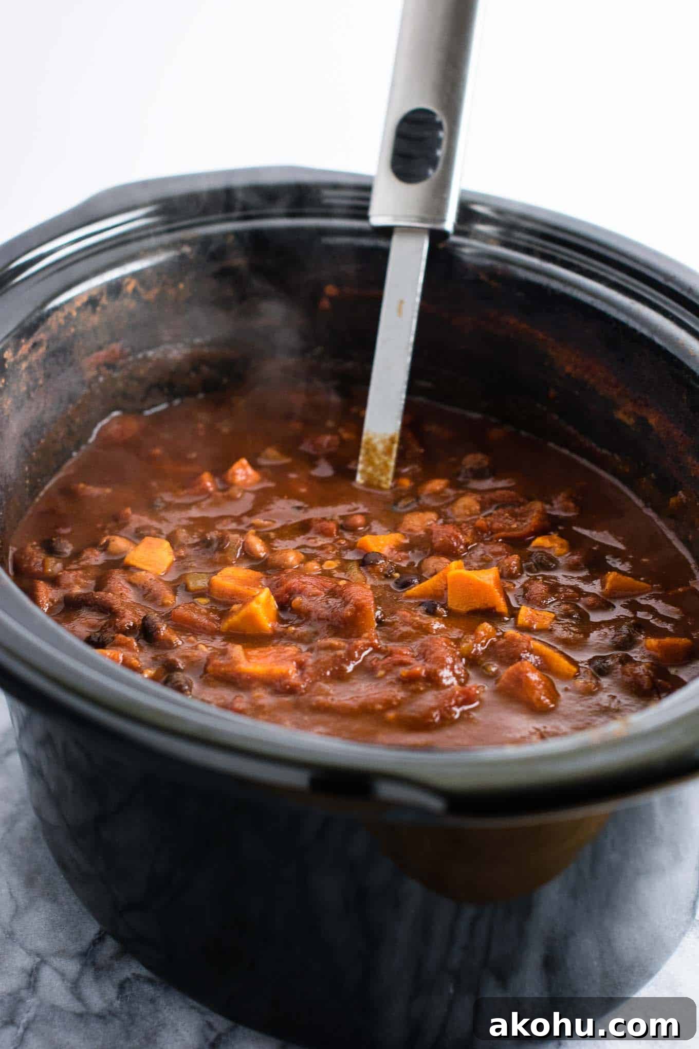 vegan dinner recipes - This slow cooker vegetarian sweet potato chili takes just 10 minutes to prep! #vegetarian #chili #sweetpotatochili #meatless #dinner #slowcooker #crockpot