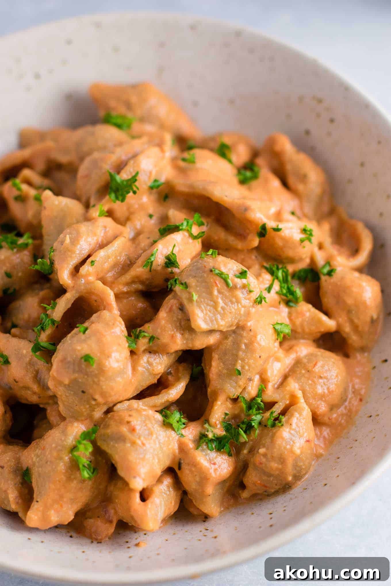 Creamy Tomato Shells are the ultimate vegan comfort food. Made with whole wheat pasta, and naturally creamy thanks to cashews and almond milk. You won’t believe how good this tastes! #vegan #creamsauce #creamytomatoshells #veganrecipe