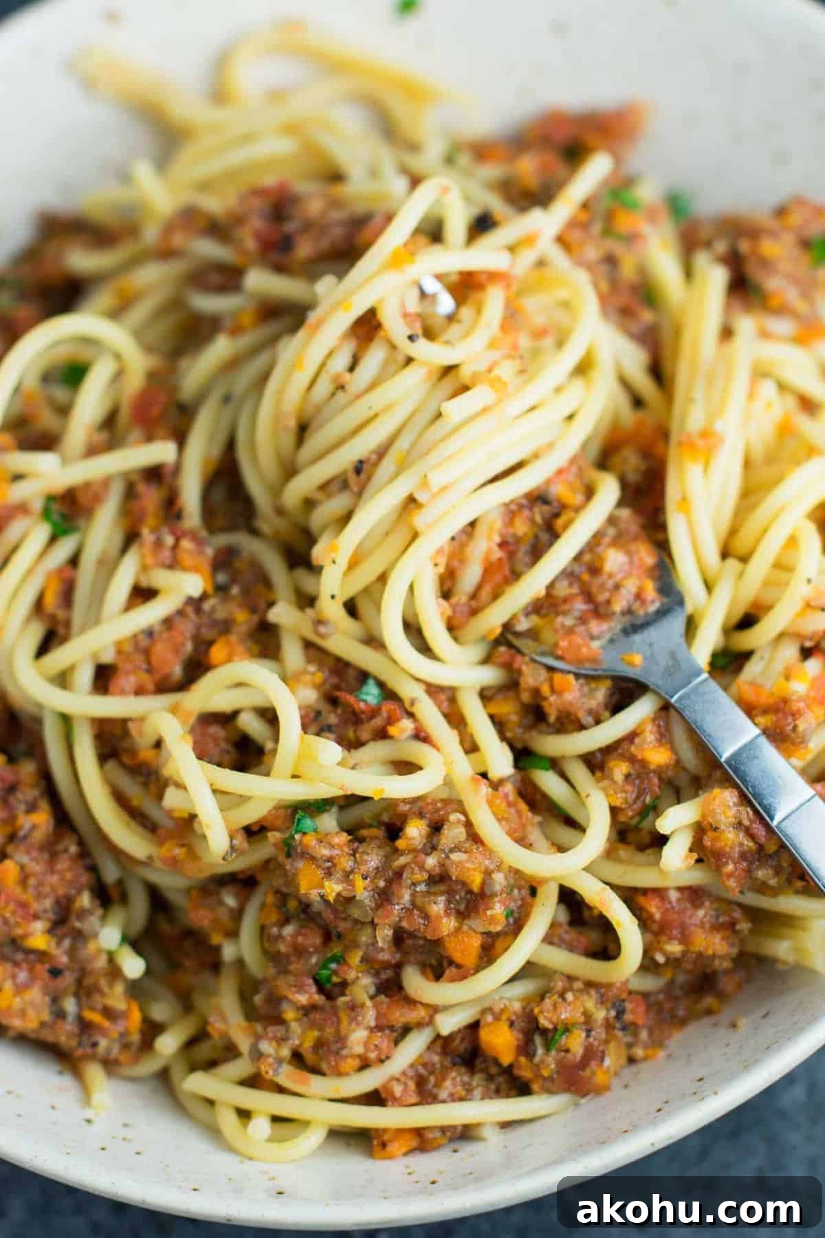 Vegetable bolognese recipe made with mushrooms, carrots, celery, garlic, and onion. A delicious meatless vegetarian "meat" sauce recipe. #vegetablebolognese #vegan #vegetarian #bologneserecipe