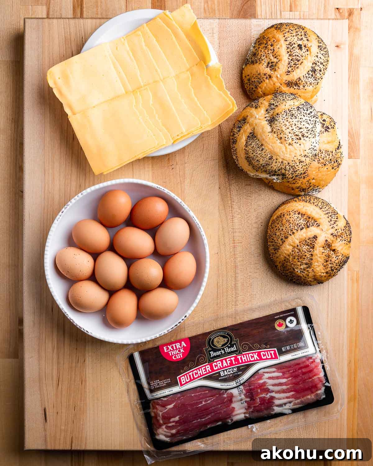 Ingredients shown: American cheese, deli rolls, eggs, and Boar's Head bacon.